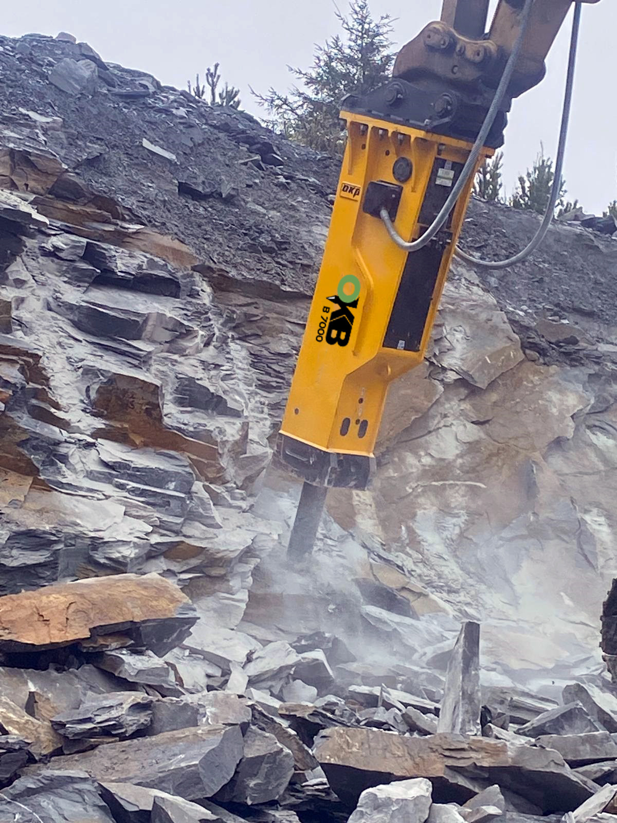 OKB Breaker attachment breaking up some rubble